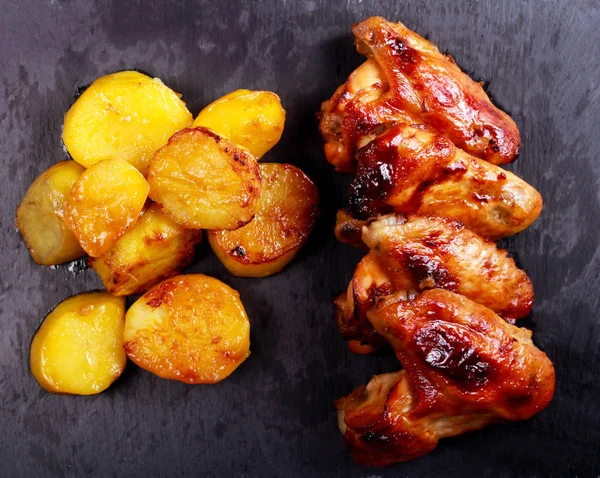 Sticky chicken wings and potato