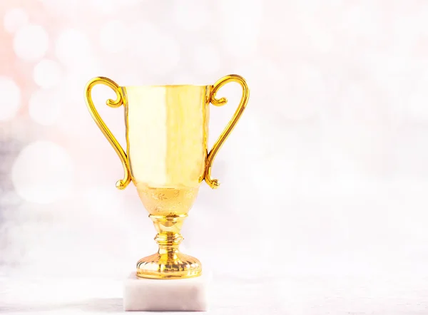 Golden trophy over bokeh — Stock Photo, Image