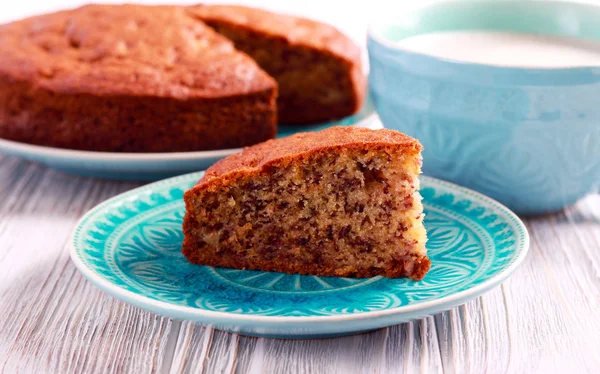 Banana cake, sliced on plate — Stock Photo, Image