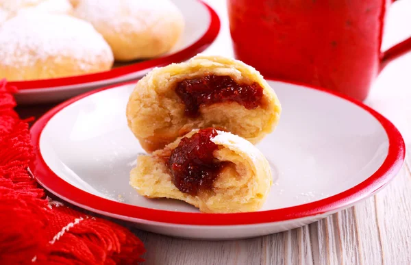 Jam filling doughnuts coated with icing sugar — Stock Photo, Image