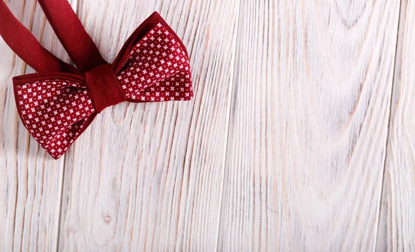 Bow tie over light wooden background — Stock Photo, Image