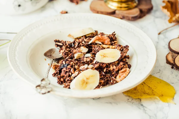 Homemade chocolate granola with banana and peanut butter — Stock Photo, Image