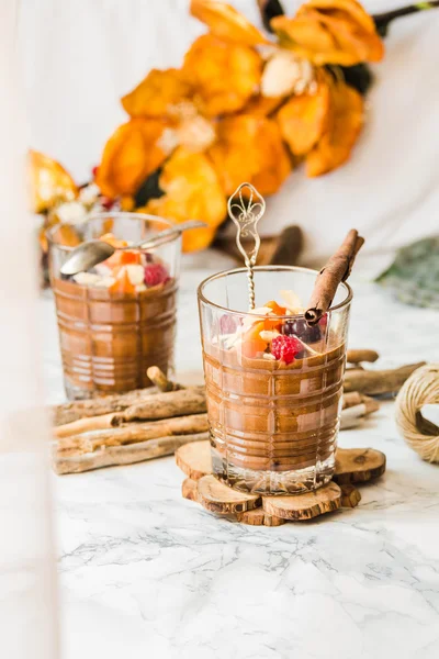 Pumpkin chocolate mousse with cinnamon, almonds and berries — Stock Photo, Image