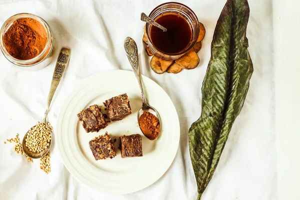 Raw brownie with figs and green buckwheat, vegan diet, top view — Stock Photo, Image