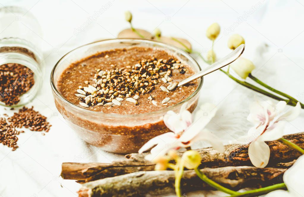 raw porridge from flax seeds with cocoa, banana and green buckwh