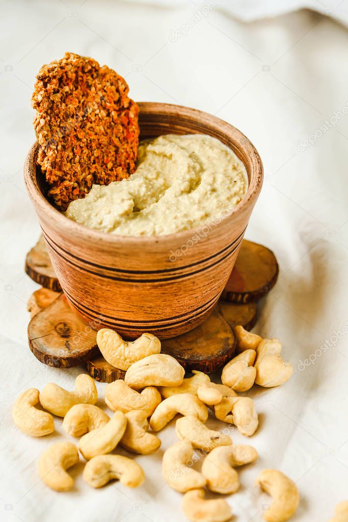 Cashew sauce, raw vegan cheese from nuts with carrot cracker
