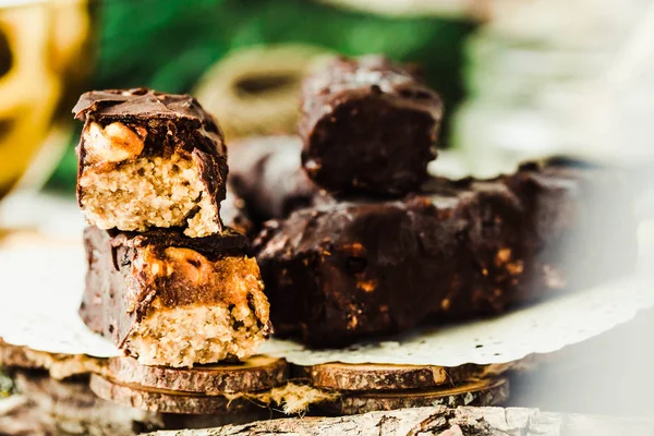 Homemade raw chocolate candy snickers bars. Vegan dessert.