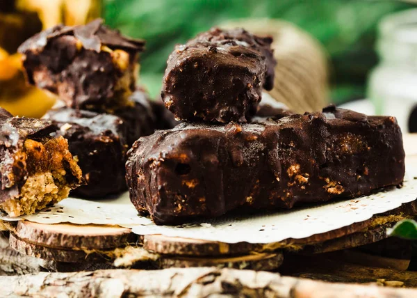 Homemade raw chocolate candy snickers bars. Vegan dessert.