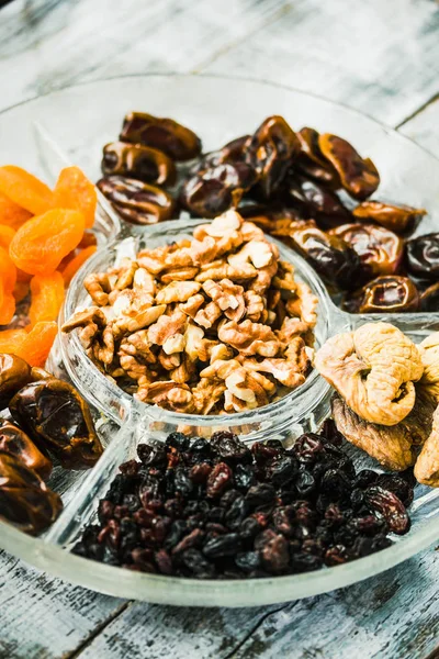 Mix of dried fruits and nuts, health food concept.