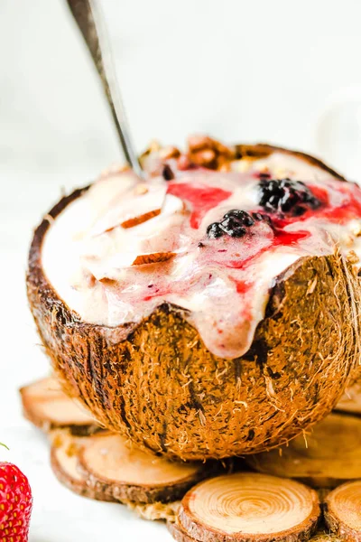 Berry smoothie with peanut butter and strawberry sauce in a coco — Stock Photo, Image