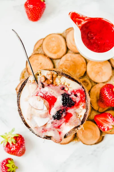 Berry smoothie with peanut butter and strawberry sauce in a coco — Stock Photo, Image