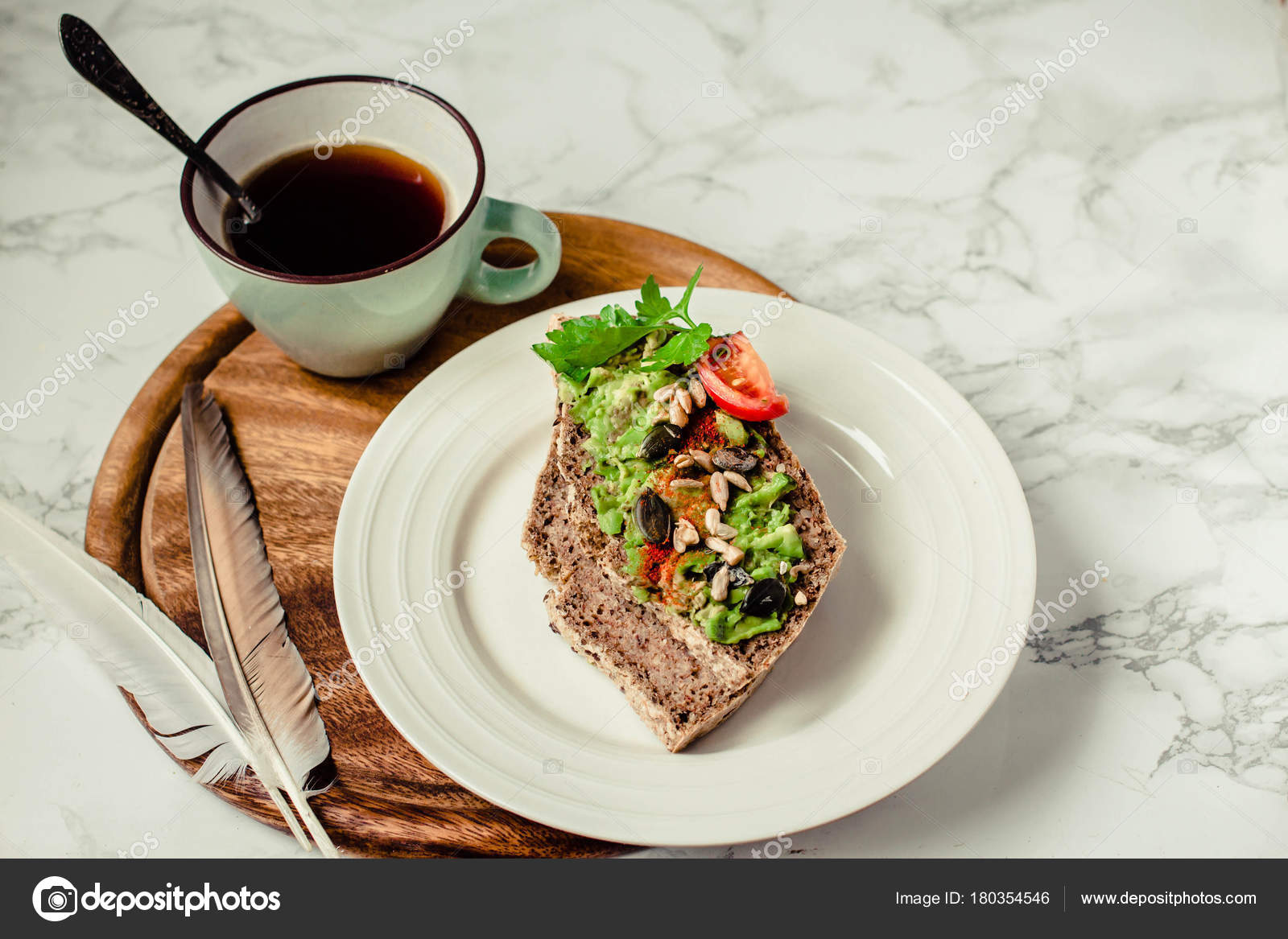 Toast of gluten fries with guacamole with tomatoes, seeds and he