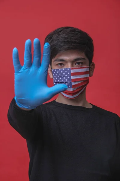 Stop Coronavirus in United States. Graphic of surgical mask with american flag. Novel coronavirus (2019-nCoV or CoVid-19). Medical face mask as concept of coronavirus quarantine. Coronavirus outbreak.