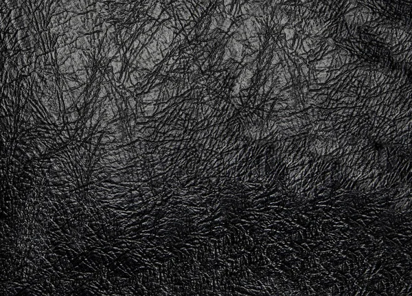 Vera e propria texture artificiale in pelle nera Immagine Stock