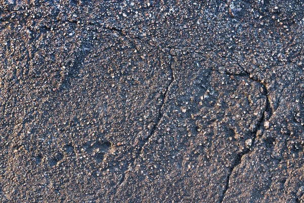 Textura tmavých asfaltu s drceným kamenem — Stock fotografie