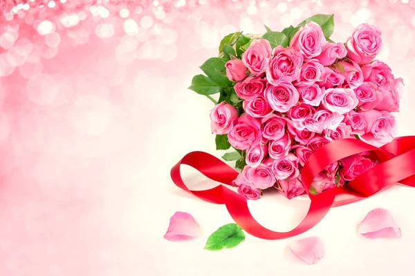a bouquet sweet pink roses  petal on  soft sweet pink backgroun