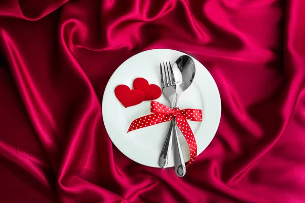 Red heart shape with White empty plate with fork and spoon — Stock Photo, Image