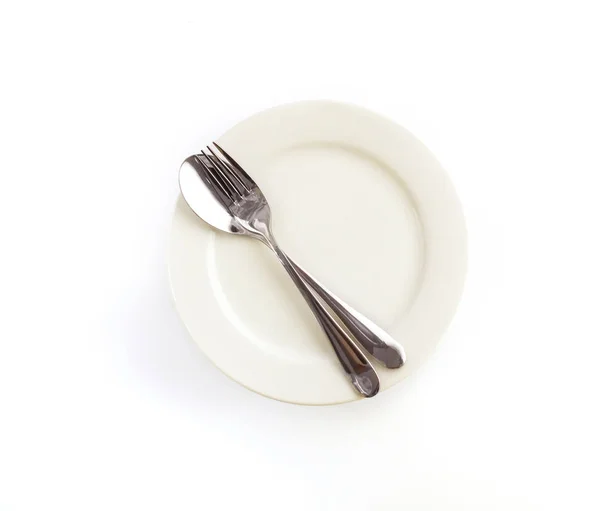 Cerrar cenando el tenedor de plata, cuchara y cuchillo con plato —  Fotos de Stock