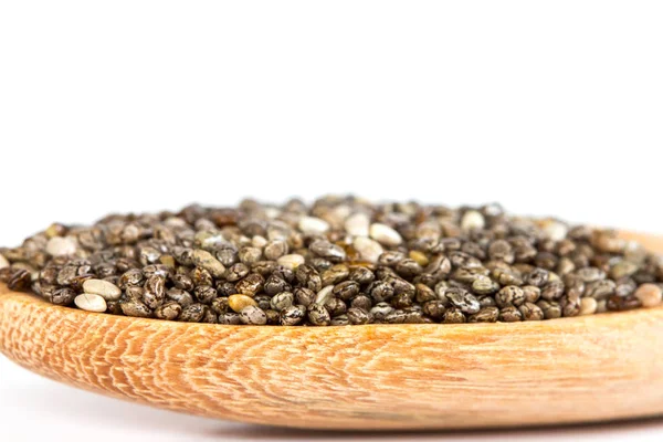 Close up chia seeds in wooden spoon on white background — Stock Photo, Image