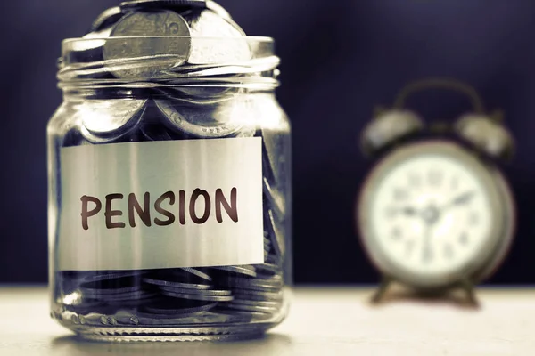 Close up Coins in glass jar for giving and pension concept , dar — Stock Photo, Image