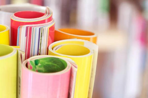 Close up edge of colorful magazine stacking roll Stock Picture