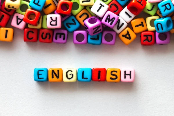 Kleurrijke Engels woord kubus op wit papier achtergrond, Engels la — Stockfoto