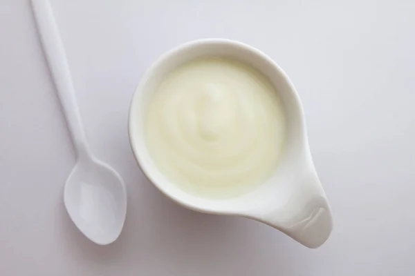 Close up natural creamy white yogurt in cup — Stock Photo, Image