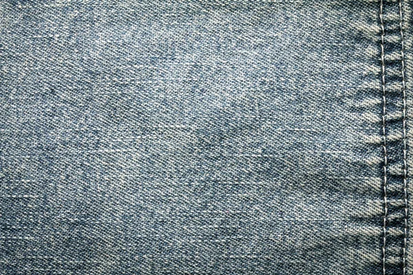 Feche a superfície jeans jeans azul denim com costura textura backgro — Fotografia de Stock
