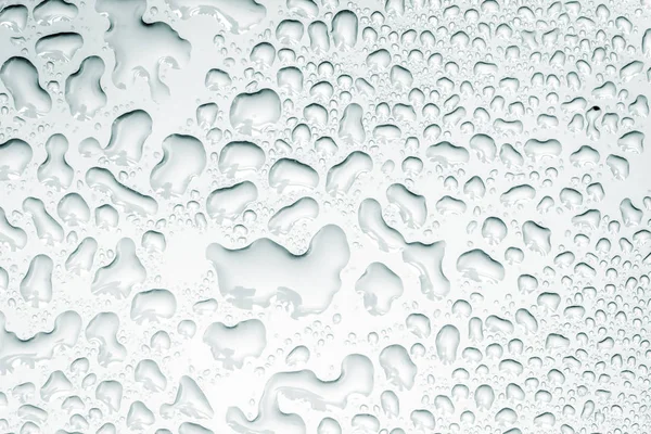 Abstrakt vattendroppe på ytan av vit bakgrund — Stockfoto