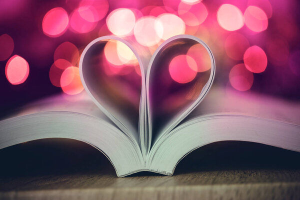 The Book page decorate to heart shape with celebration bokeh lig