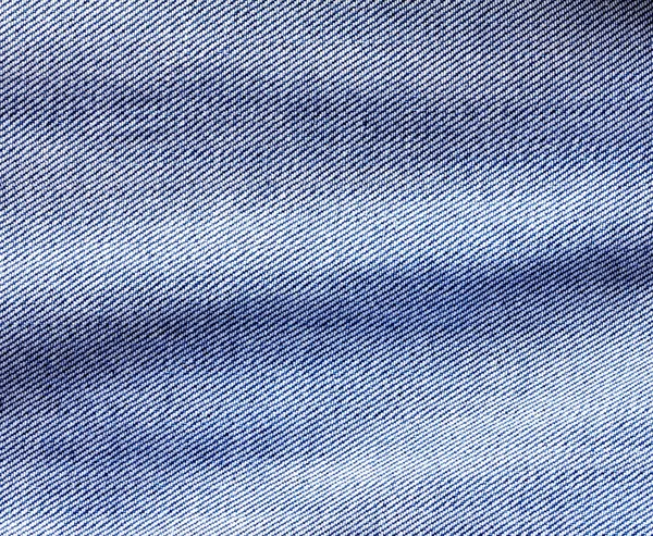 Detailní záběr džínově modré džíny povrchu s vlnou textury pozadí — Stock fotografie