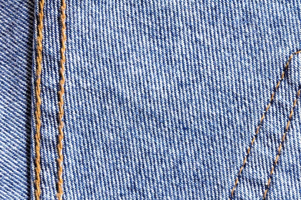 Close up the denim  blue jeans surface with seam texture backgro — Stock Photo, Image