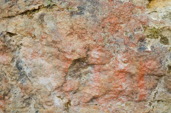 Old stone wall, texture of an ancient cave