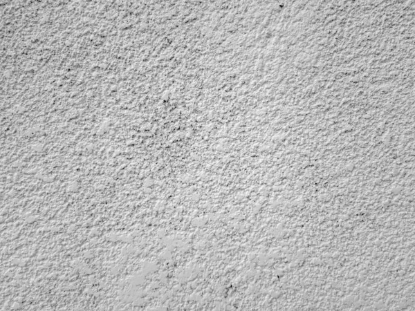 Putty concrete wall, spray cement concrete finisher. The texture of the background, spontaneously imposed on the wall is cement plaster. Abstract backgrounds.