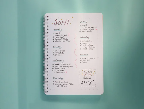 Concept of schedule for one week. To do list in a notepad