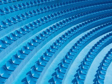 Spor geometrik desen. Plastik koltukların yarı dairesel sıraları. Mavi trend tasarımcı arkaplanı