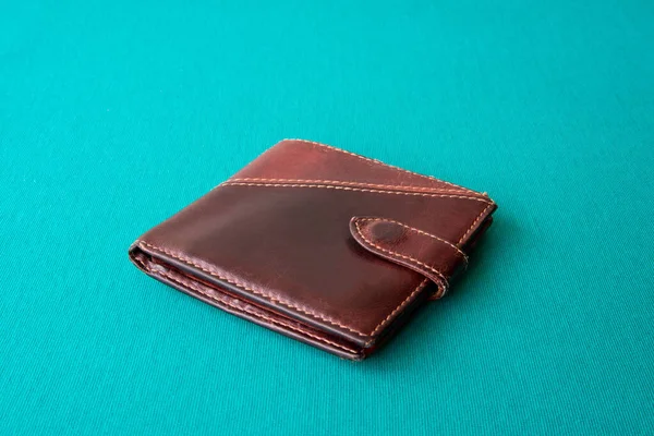 Empty wallet with no money in the background.Bankruptcy is an empty wallet.It is not possible to repay the loan and mortgage.Old and empty brown wallet