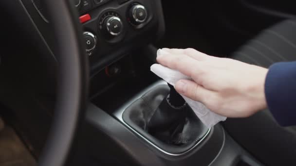 Hand disinfect the gear stick knob in the car using wet wipe Coronavirus Epidemic Outbreak. — Stock Video