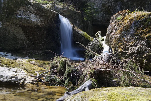 Waterfall cascade in long time exposure in the sunlight