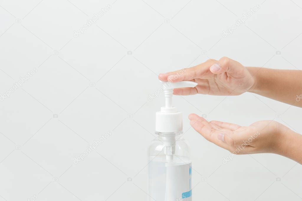 A girl using washing hand with Alcohol Sanitizer isolate on a white background. Promoting people use  to protect themselves from virus infection in Corona virus crisis 2020