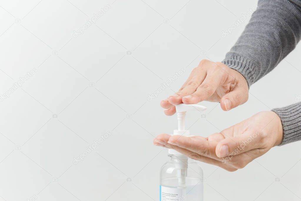 Female hands using washing hand with Alcohol Sanitizer isolate on a white background. Promoting people use  to protect themselves from virus infection in Corona virus crisis 2020