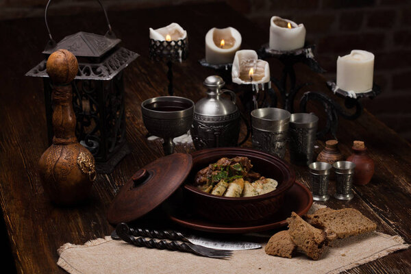 roast potatoes with meat in pot