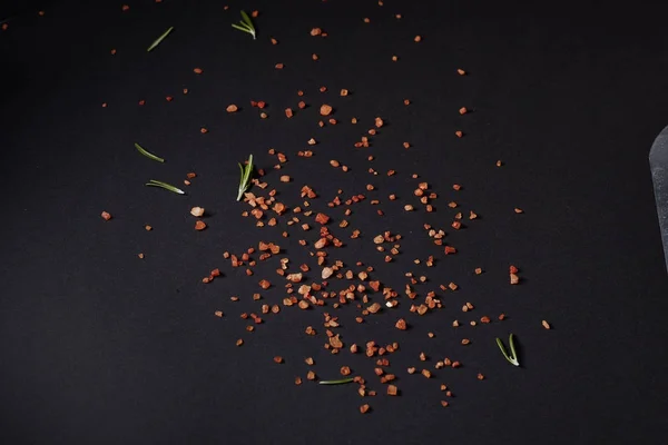 Spices scattered on a black background — Stock Photo, Image