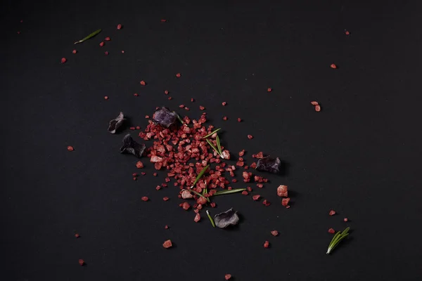 Spices scattered on a black background — Stock Photo, Image