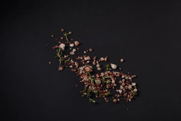 Spices scattered on a black background — Stock Photo, Image