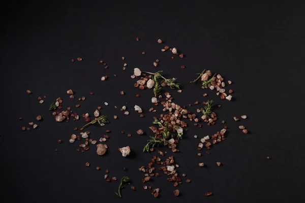 Spices scattered on a black background — Stock Photo, Image