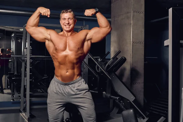 Adult man shows his athletic, inflated body. — Stock Image Adult man shows his athletic, inflated body. Stock Photo