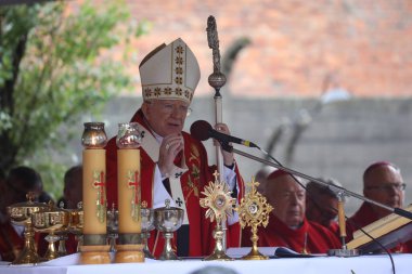 Oswiecim, Auschwitz, Poland -14 August 2019: Krakow's archbishop Marek Jedraszewski celebrates a mass during the anniversary of martyrdom of St. Father Maksymilian Kolbe. clipart
