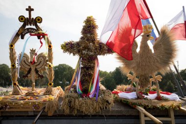 Czestochowa, Poland -  02 September 2018: nationwide harvest festival on the Jasna Gora Monastery in Czestochowa, pilgrims in traditional costumes with harvesting wreath clipart