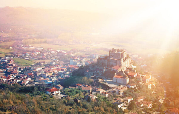 Panoramic viev on an ancient castle in Italy at sunrice time.